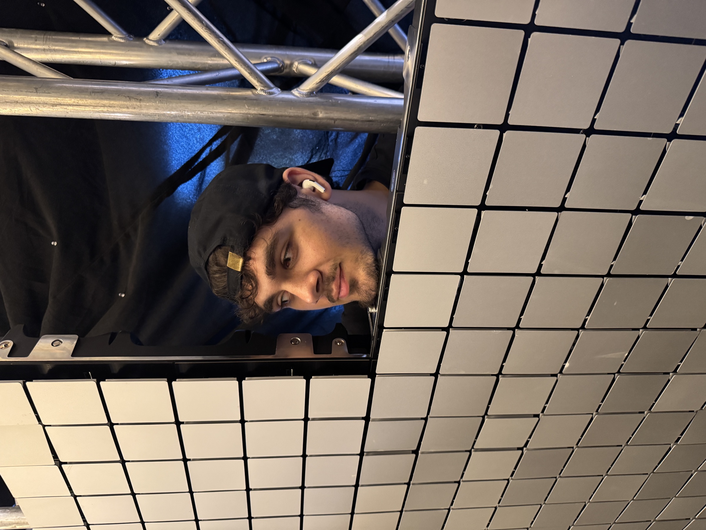 NovaTech technician mounting a kinetic media surface