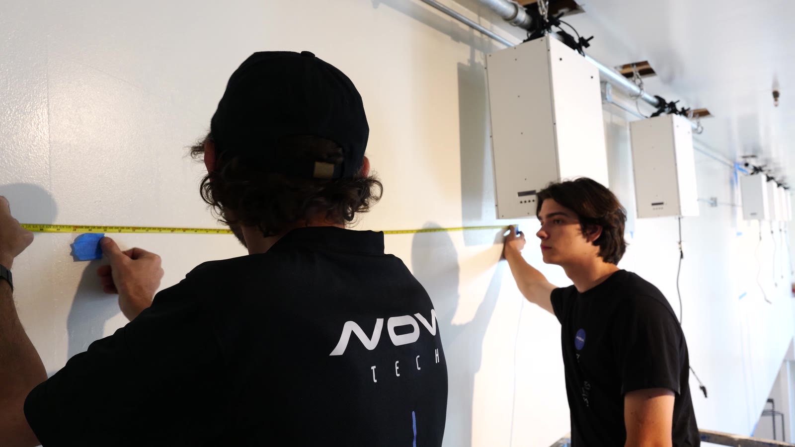 Installation team preparing a commercial media system on site